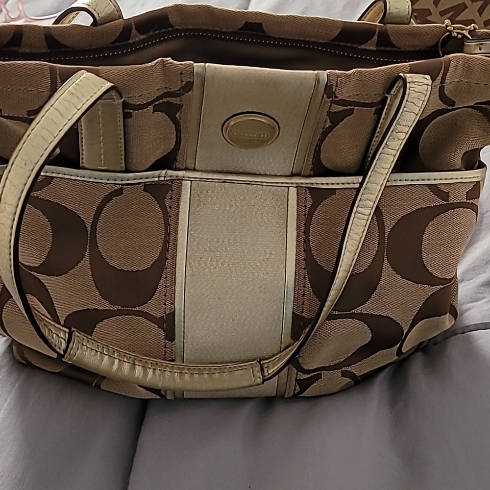 Gold tan coach bag.